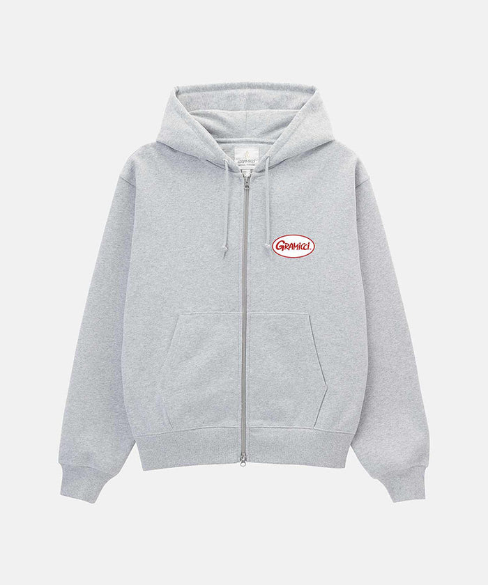 Gramicci heather grey Oval Patch Zip Hooded Sweatshirt with a red and white patch against a light-tone background.
