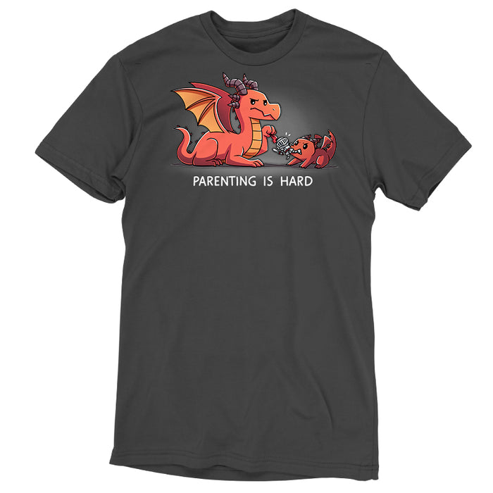 Premium Cotton T-shirt_TeeTurtle charcoal gray Parenting is Hard apparel featuring a parent dragon holding onto a toy knight while its baby dragon grabs it with its mouth.