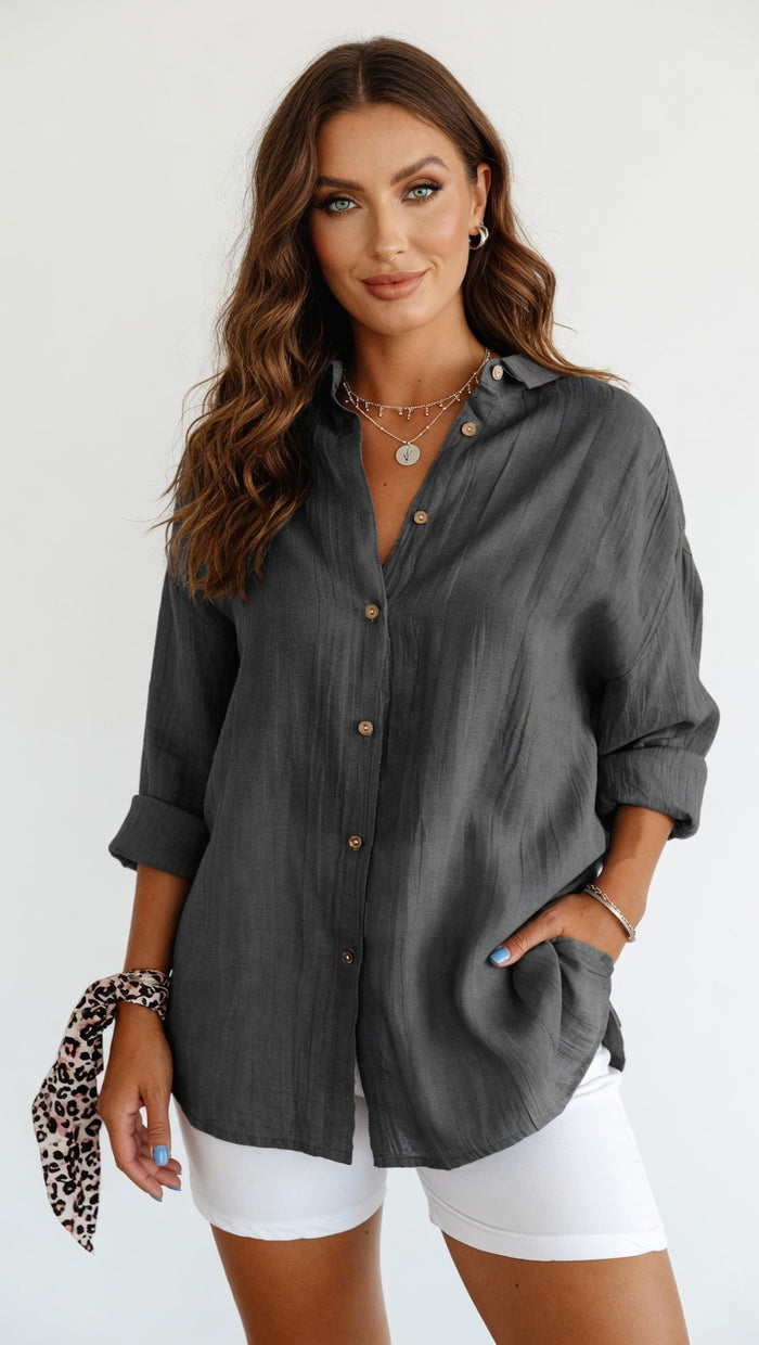 Women’s loose fit pleated blouse with mid-length cut and office-ready shape