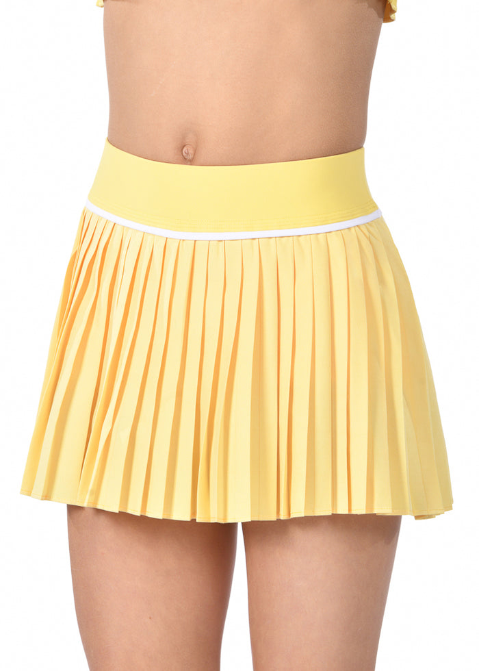 Yellow pleated skirt worn by a person on a white background