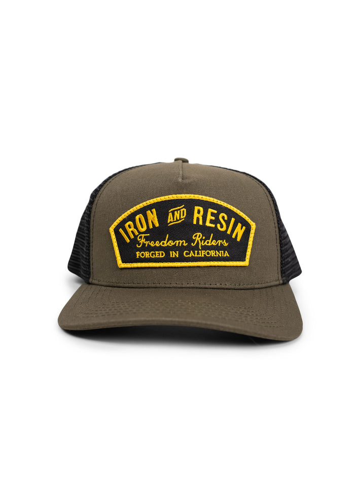 Brown mesh cap with "Iron and Resin" patch, "Freedom Riders" text, and "Forged in California" slogan in yellow and black.