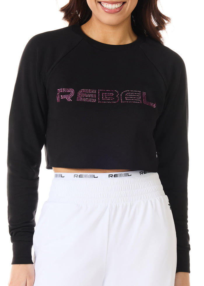 Person wearing a black 'REBEL' sweatshirt with white pants on a white background