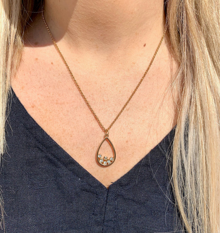 Rowan drop necklace gold on model.