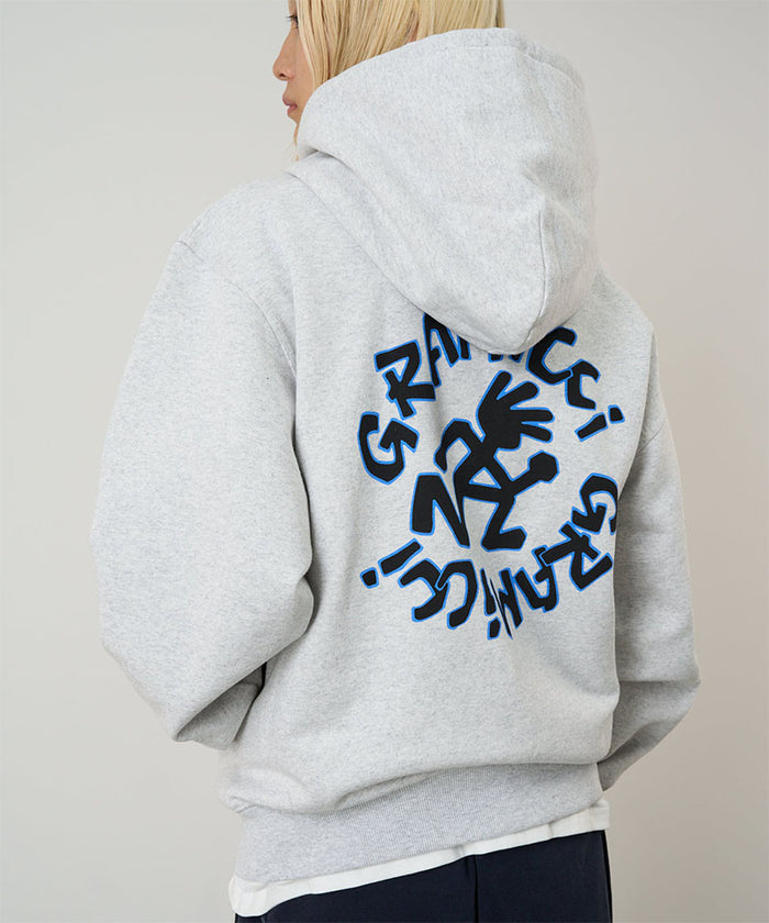 Model wearing heather ash Gramicci Running Man Zip Hooded Sweatshirt on a light-tone background.