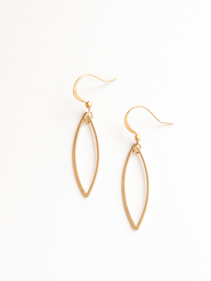 sady earrings in matte gold on flat lay