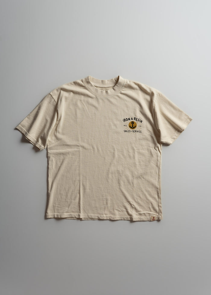 Beige T-shirt with "Iron & Resin Sales & Service" logo on chest, laid flat on a light gray background.