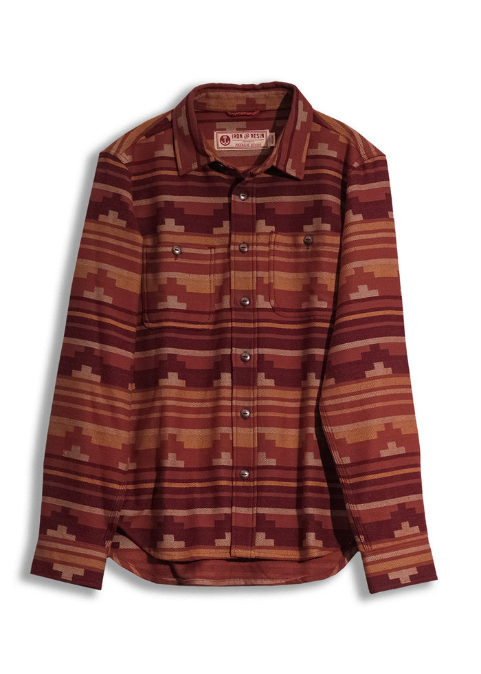Red and brown patterned button-up shirt with geometric design, featuring two chest pockets and a collar.