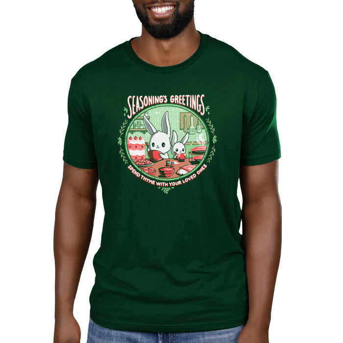 Premium Cotton T-shirt_TeeTurtle forest green Seasoning's Greetings apparel featuring two cartoon rabbits preparing food in a kitchen with the text "SEASONING'S GREETINGS" above them and "Spend Thyme With Your Loved Ones" below. Holiday baking decorations frame the scene.