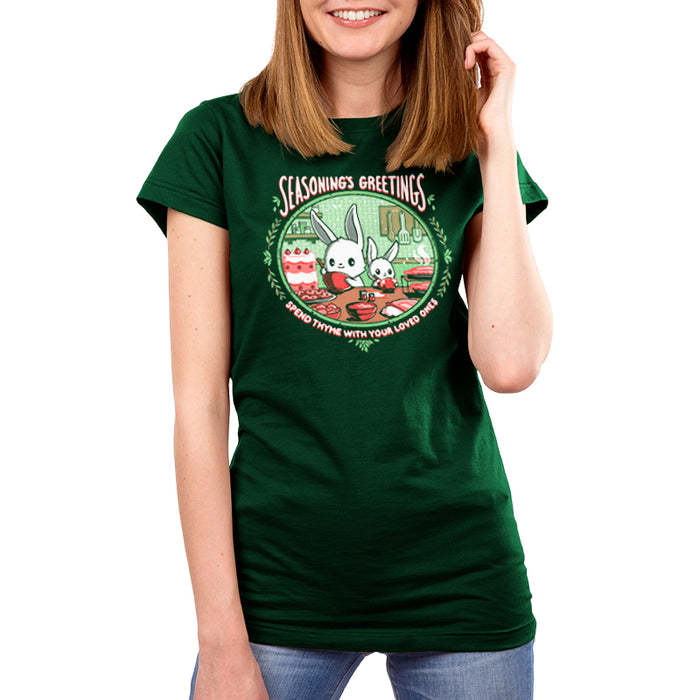 Premium Cotton T-shirt_TeeTurtle forest green Seasoning's Greetings apparel featuring two cartoon rabbits preparing food in a kitchen with the text "SEASONING'S GREETINGS" above them and "Spend Thyme With Your Loved Ones" below. Holiday baking decorations frame the scene.