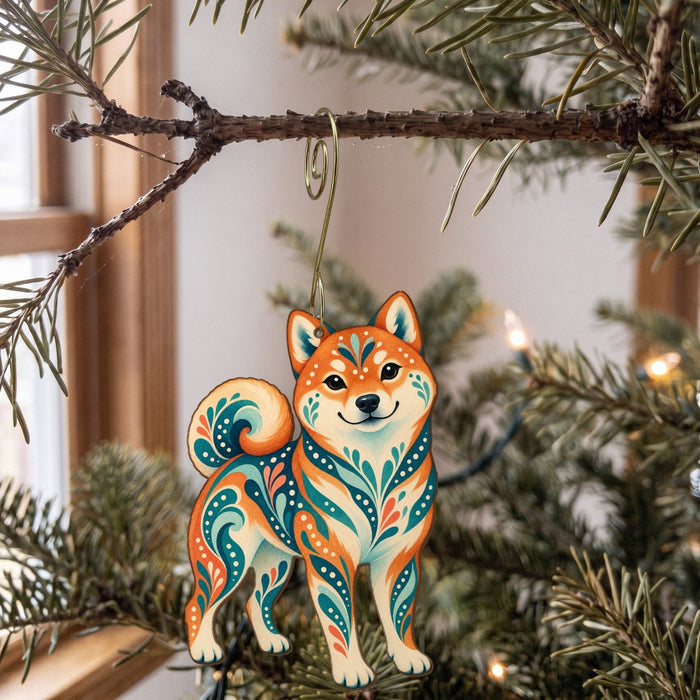 Laser-cut maple wood Shiba Inu folk art ornament O449 hanging on a fir branch, made in USA