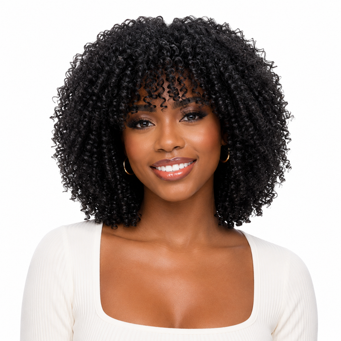 Close-up of short curly wig texture showing defined curls, soft movement, slanted bangs and a polished finish for daily wear.