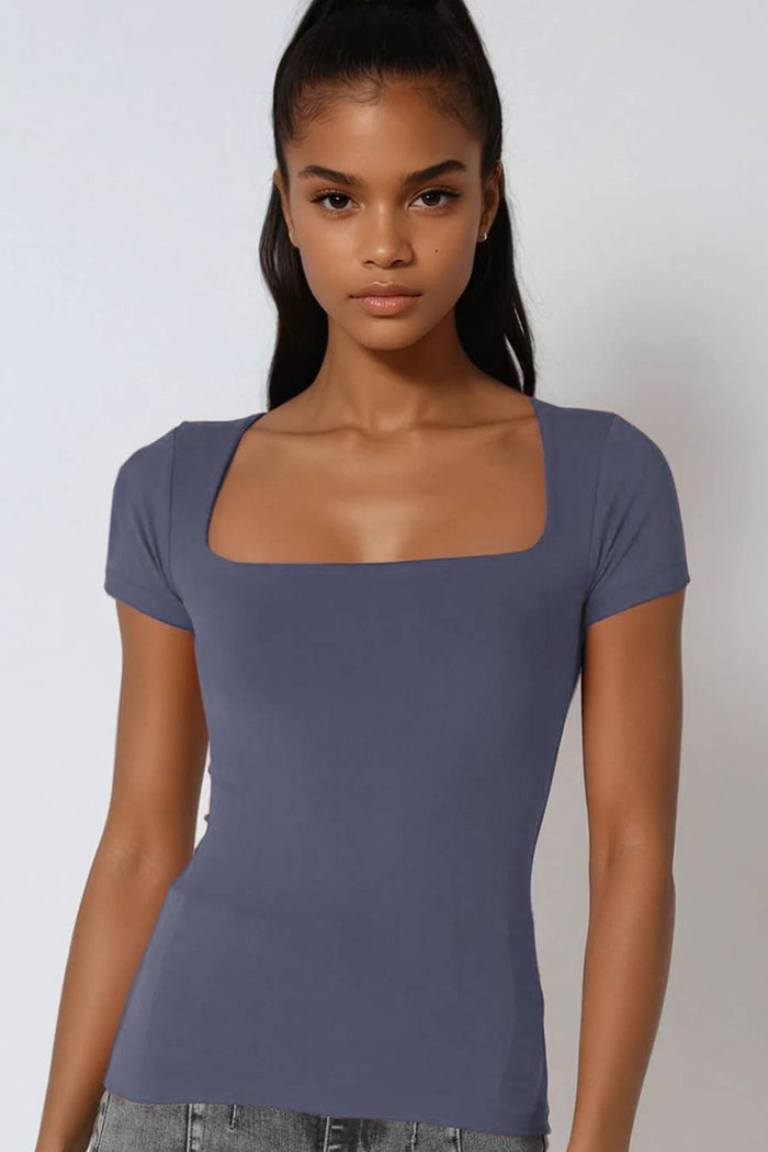 Solid square neck cap sleeve seamless top with a fitted silhouette and clean minimalist design.