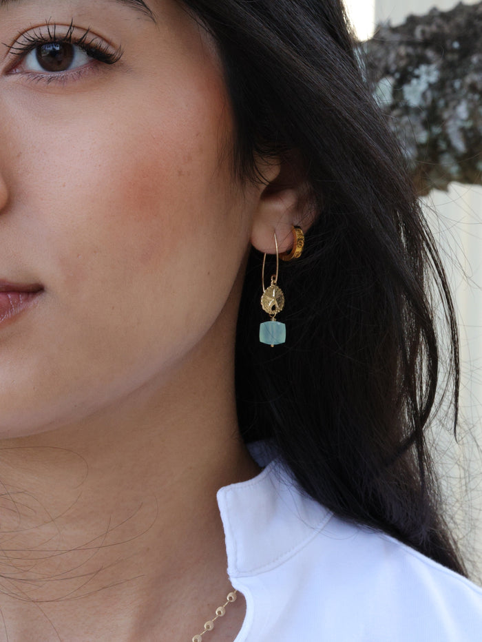 starfish Peruvian chalcedony earrings close up on model