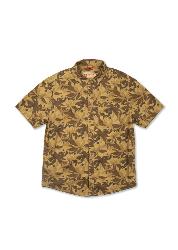 Short-sleeve shirt with a brown and tan leaf pattern, buttoned front, and a collar, displayed against a white background.