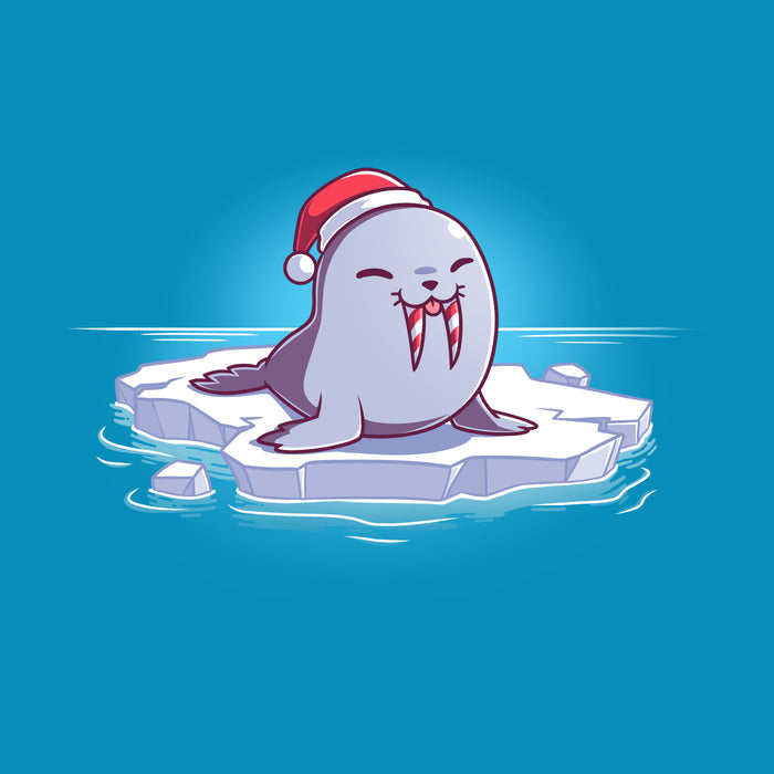 Premium Cotton T-shirt_TeeTurtle cobalt blue Sweet Tooth apparel featuring an illustration of a happy walrus sticking out it's tongue, wearing a Santa hat, and sitting on a floating ice. It's tusks are striped with red and white like candy canes.