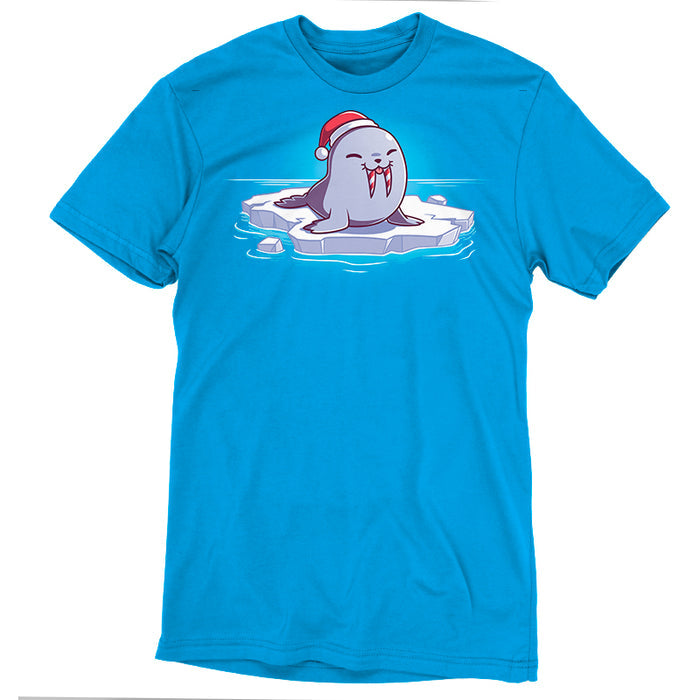 Premium Cotton T-shirt_TeeTurtle cobalt blue Sweet Tooth apparel featuring an illustration of a happy walrus sticking out it's tongue, wearing a Santa hat, and sitting on a floating ice. It's tusks are striped with red and white like candy canes.