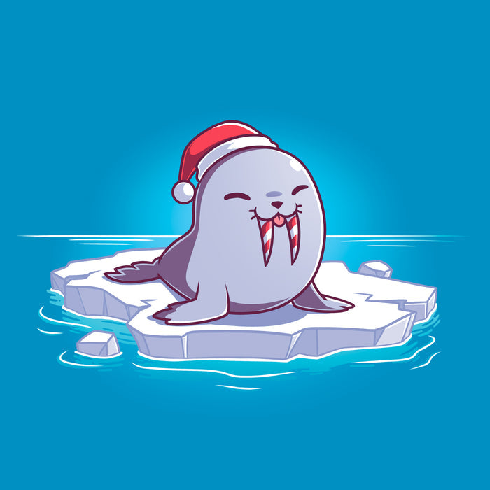 Classic Cotton T-shirt_TeeTurtle sapphire blue Sweet Tooth apparel featuring an illustration of a happy walrus sticking out it's tongue, wearing a Santa hat, and sitting on a floating ice. It's tusks are striped with red and white like candy canes.