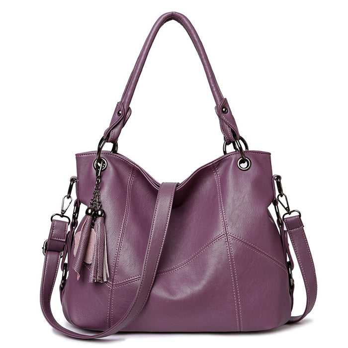 Deep blue retro tassel shoulder bag sandwich pocket organization detail