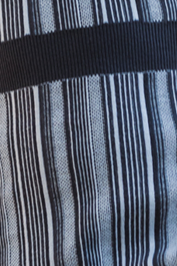 Close-up of fabric from the Ivy City Co Teen Laurel Dress in Midnight, featuring vertical black and white stripes and a single thick horizontal black stripe across the center—a striking pattern characteristic of this midi-length dress.