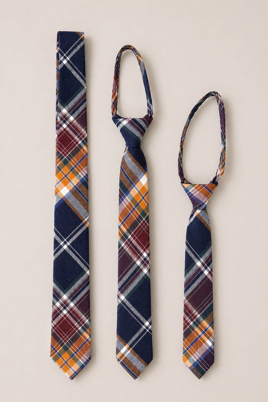 Three Ties in Midnight Plaid by Ivy City Co—available in adult, youth, and child sizes—are displayed side by side on a neutral background. Each tie is crafted from soft cotton and showcases a vibrant pattern of navy, orange, white, and burgundy stripes, making these ties the perfect wedding accessory for every family member.
