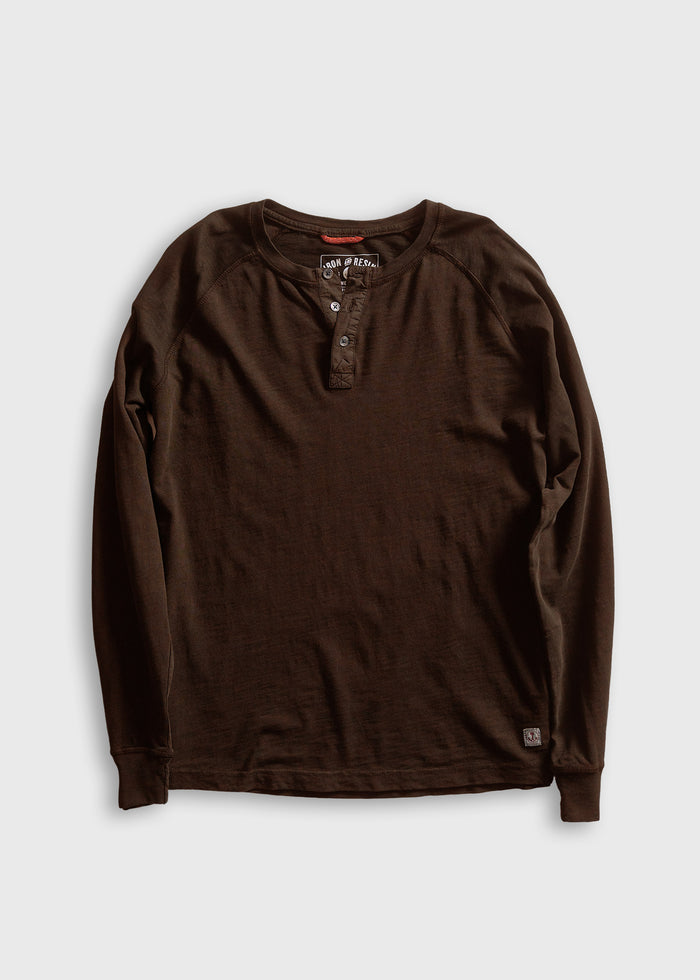 Dark brown long-sleeve henley shirt with three buttons, laid flat on a white background, showcasing casual style and texture.