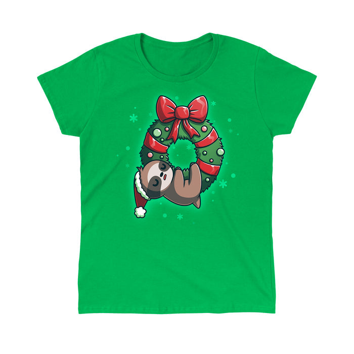 Classic Cotton T-shirt_TeeTurtle We Wish You a Lazy Christmas Irish green t-shirt featuring a cartoon sloth in a Santa hat, snoozing while hanging from a festive wreath adorned with red ribbons and ornaments.
