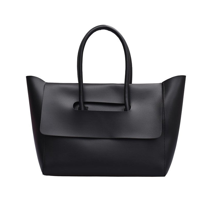 women shoulder bag worn casually with neutral outfit emphasizing effortless elegance