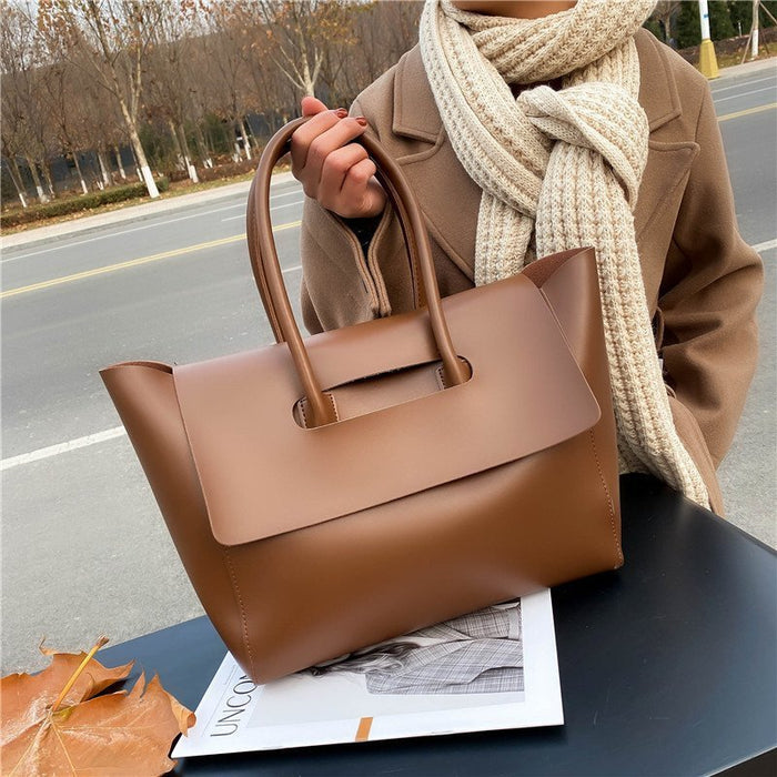 women shoulder bag shoulder strap detail showing clean stitching and solid construction