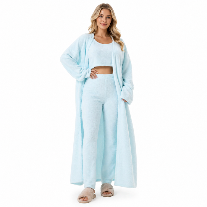 Model wearing a fluffy knit three-piece lounge set with long cardigan and wide-leg pants on a white studio background.