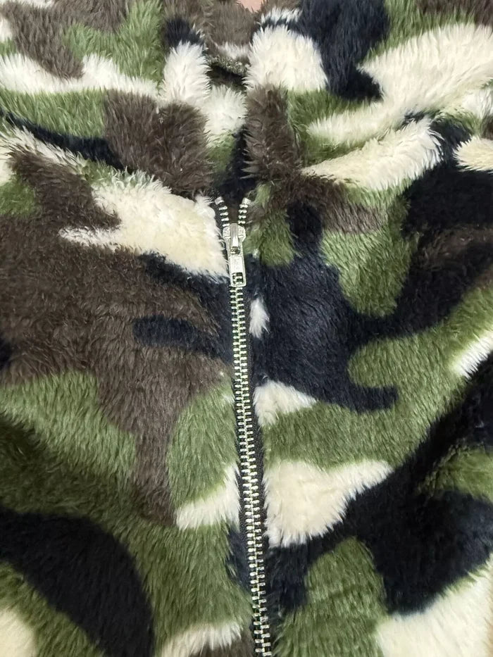 Pocketed fuzzy camo hoodie for women in 100% polyester, made for casual outfits, travel days and relaxed street styling ease.