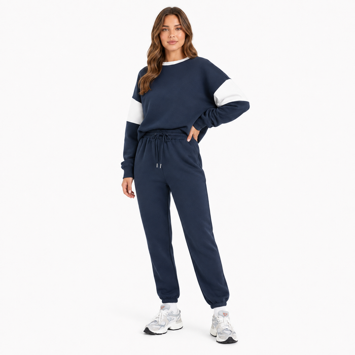 Women's navy drop shoulder sweatshirt set back view on model against a clean white studio background
