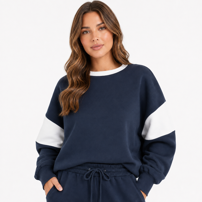 Women's navy drop shoulder sweatshirt set close view highlighting neckline sleeve panels and waistband