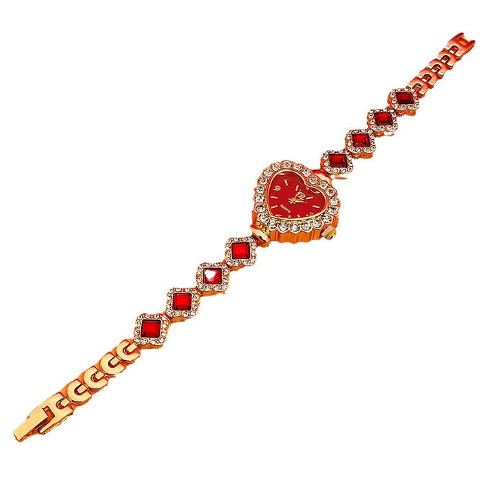 Layered gold chain and faux pearl bracelet with red heart pendants styled with women’s heart bracelet watch for date night