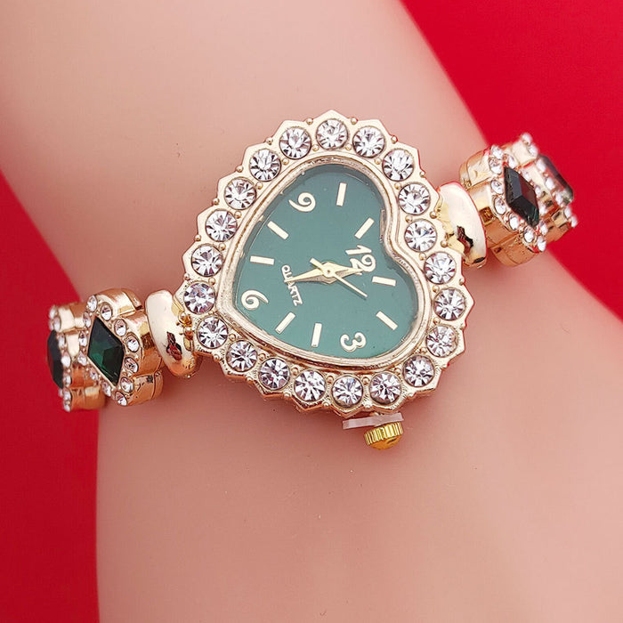 Gift-ready women’s heart shaped bracelet watch set with red, green and black dials displayed on wrist against red background