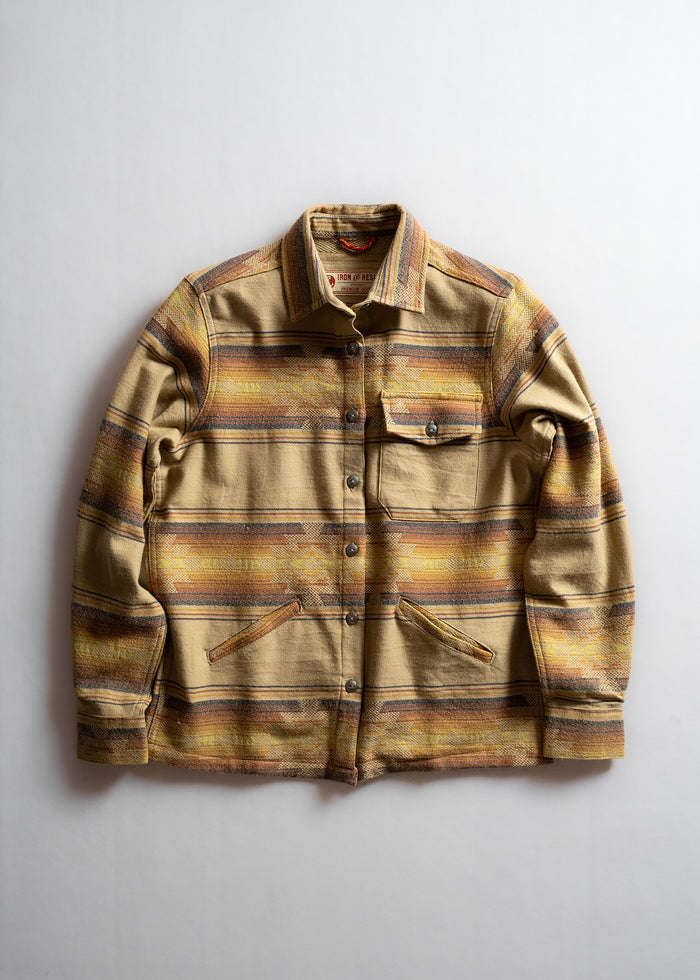 Striped beige jacket with button closure, chest pocket, and two side pockets, displayed on a light background.