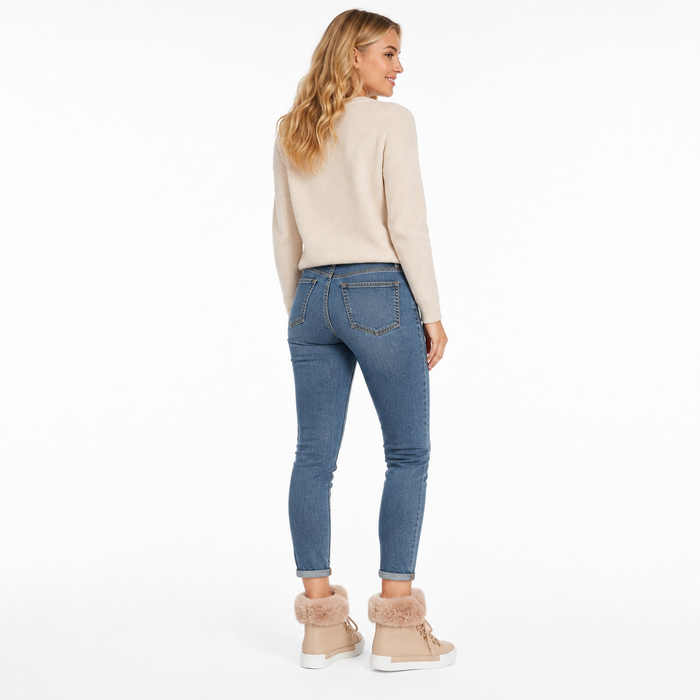 Women's beige lace-up ankle boots with fuzzy faux fur collar shown from the back on model