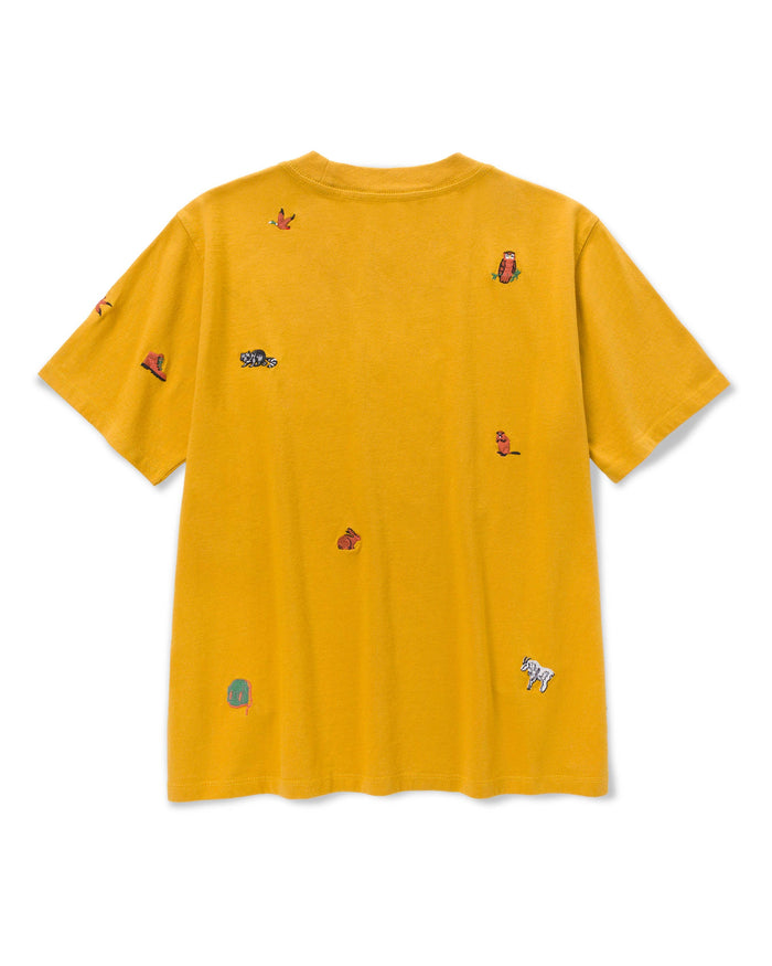 Back view of mustard yellow Women's Naturalist Club Boxy Tee with tiny embroidered animals scattered across the fabric