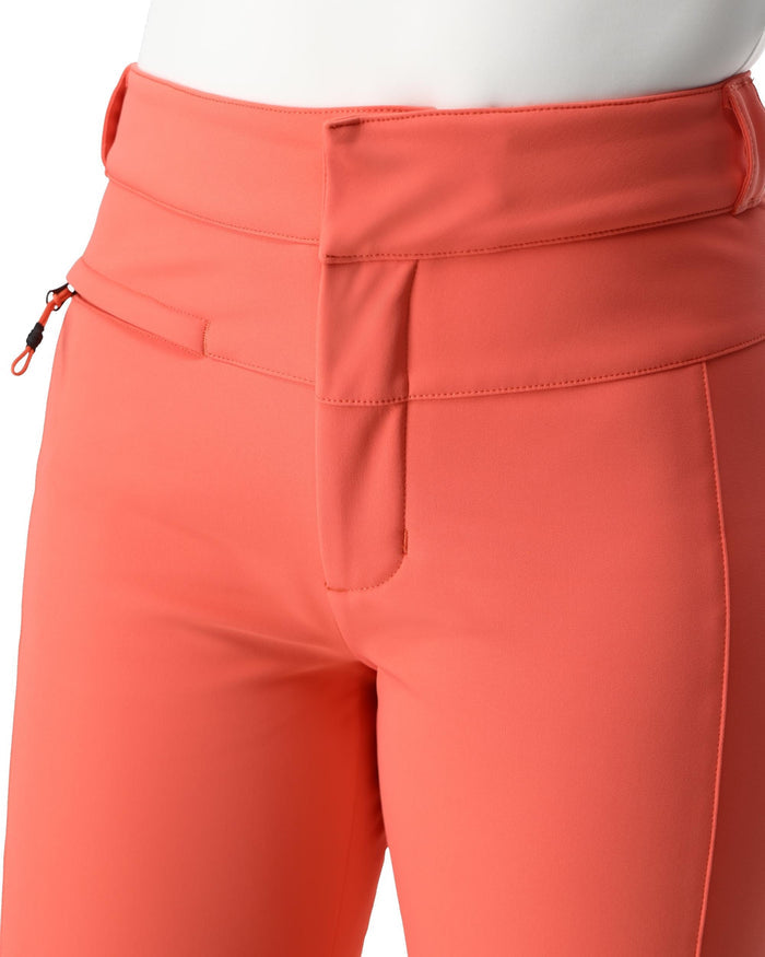 Close-up of coral-colored pants with a pocket and zipper detail on a white background