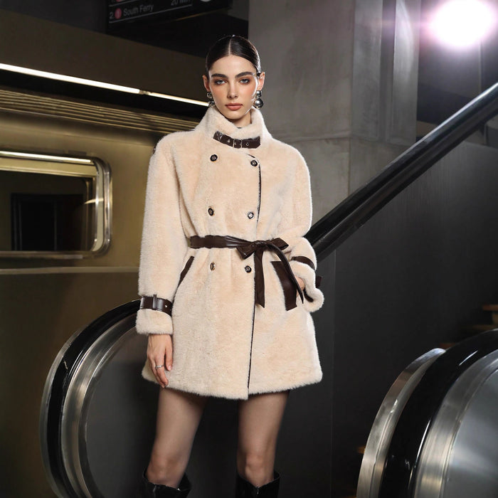 "Woman wearing apricot overcoat walking city street"