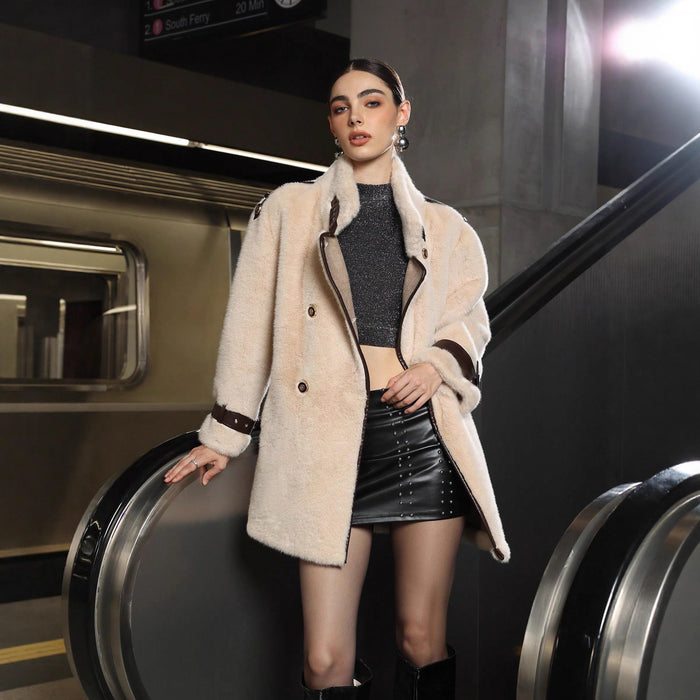 "Luxury faux fur jacket hanging on rack, full length"