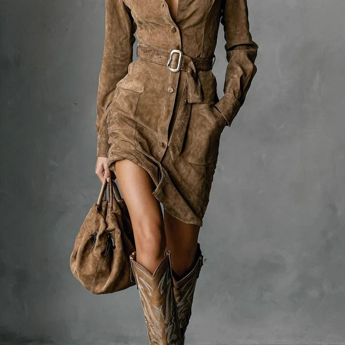 Model wearing belted blouse dress, full length outdoor setting