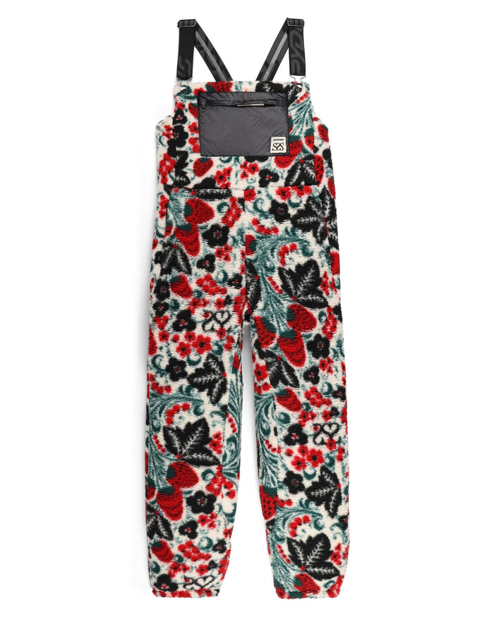 Floral patterned overalls with black straps on a white background