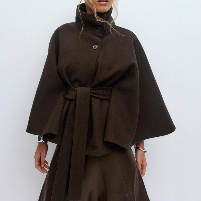 "women's stand collar trench coat in coffee color styled with jeans and boots for effortless city street look"