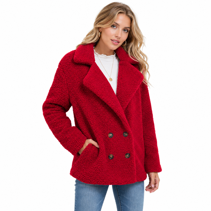 Women's red teddy winter coat editorial pose on white background