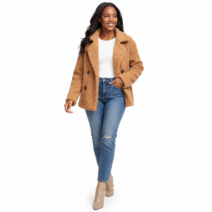 Women's camel teddy winter coat walking pose on white background