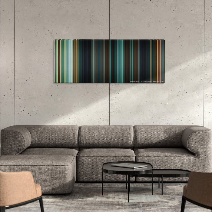 Wonder Woman color palette canvas on a concrete wall above a gray sectional sofa