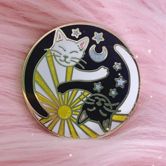 Yin Yang Cats enamel pin featuring a white and black cat amid stars and a crescent moon.