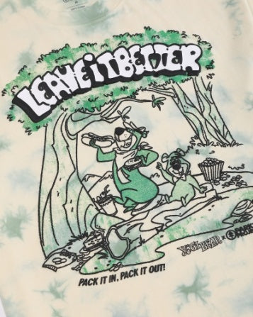 Close up of the front graphic on the Yogi Bear Pack It Out tee showing Yogi Bear camping beside trees with the Pack It In Pack It Out slogan.